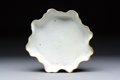 A Chinese green-enamelled lotus leaf-shaped brush washer and a Dehua blanc de Chine Milefo Buddha, 19th C