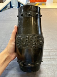A Chinese archaistic bronze vase and a tripod censer, Yuan