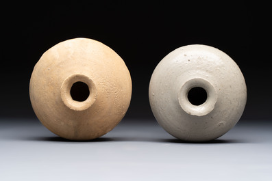 Three cream-glazed bottle vases and two jarlets from the Jepara shipwreck, Dehua or Anxi kilns, Song