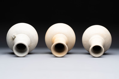 Three cream-glazed bottle vases and two jarlets from the Jepara shipwreck, Dehua or Anxi kilns, Song