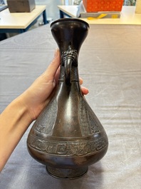 A Chinese archaistic bronze vase with dragon-form handles, Yuan/Ming
