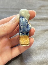 Nine Chinese blue, white, celadon-glazed and famille rose figures, 18/19th C.