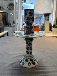 A pair of Chinese blue and white two-piece candle stick holders with brocade ball design for the Southeast Asian market, 19th C.