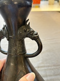 A Chinese archaistic bronze vase with dragon-form handles, Yuan/Ming