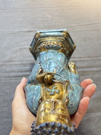 A Chinese robin's egg-glazed gilt-decorated standing Buddha, 18th C.