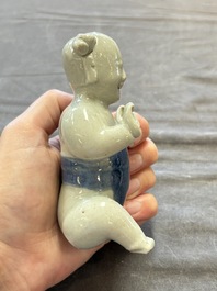Nine Chinese blue, white, celadon-glazed and famille rose figures, 18/19th C.