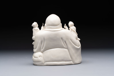 A Chinese green-enamelled lotus leaf-shaped brush washer and a Dehua blanc de Chine Milefo Buddha, 19th C