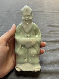 Nine Chinese blue, white, celadon-glazed and famille rose figures, 18/19th C.