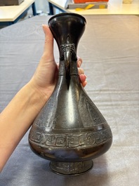 A Chinese archaistic bronze vase with dragon-form handles, Yuan/Ming