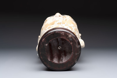 A Chinese stucco head of a Luohan, Qing