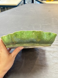 A Chinese green-enamelled lotus leaf-shaped brush washer and a Dehua blanc de Chine Milefo Buddha, 19th C