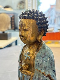 A Chinese robin's egg-glazed gilt-decorated standing Buddha, 18th C.