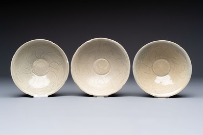 A group of 12 Chinese celadon-glazed bowls with incised floral design from the Jepara shipwreck, Fujian kilns, Song