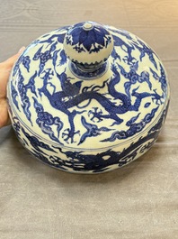 A Chinese blue and white 'dragon among clouds' cover, 20th C.