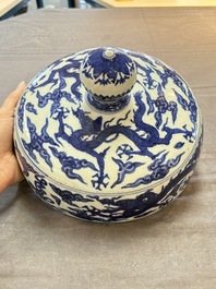 A Chinese blue and white 'dragon among clouds' cover, 20th C.