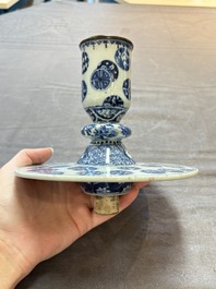 A pair of Chinese blue and white two-piece candle stick holders with brocade ball design for the Southeast Asian market, 19th C.