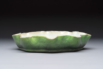 A Chinese green-enamelled lotus leaf-shaped brush washer and a Dehua blanc de Chine Milefo Buddha, 19th C