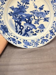 A Chinese blue and white dish with floral design, Kangxi mark and of the period