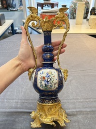 A pair of gilt-bronze-mounted Chinese famille verte powder-blue-ground double gourd vases, 19th C.