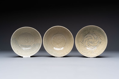 A group of 12 Chinese celadon-glazed bowls with incised floral design from the Jepara shipwreck, Fujian kilns, Song