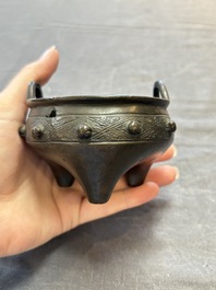 A Chinese archaistic bronze vase and a tripod censer, Yuan