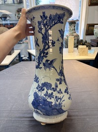 A Chinese blue and white vase with birds among flowering branches, Kangxi
