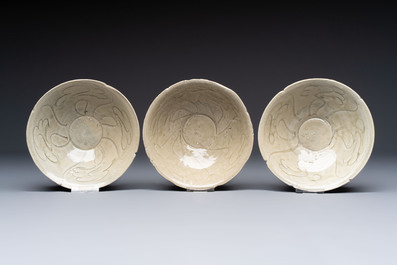 A group of 12 Chinese celadon-glazed bowls with incised floral design from the Jepara shipwreck, Fujian kilns, Song