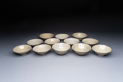 A group of 12 Chinese celadon-glazed bowls with incised floral design from the Jepara shipwreck, Fujian kilns, Song