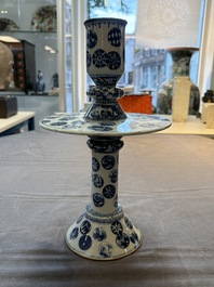 A pair of Chinese blue and white two-piece candle stick holders with brocade ball design for the Southeast Asian market, 19th C.