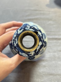 A pair of Chinese blue and white two-piece candle stick holders with brocade ball design for the Southeast Asian market, 19th C.