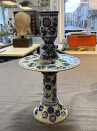 A pair of Chinese blue and white two-piece candle stick holders with brocade ball design for the Southeast Asian market, 19th C.