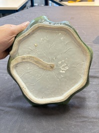 A Chinese green-enamelled lotus leaf-shaped brush washer and a Dehua blanc de Chine Milefo Buddha, 19th C