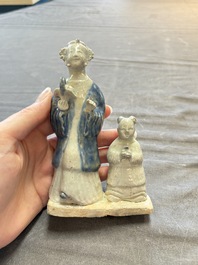 Nine Chinese blue, white, celadon-glazed and famille rose figures, 18/19th C.
