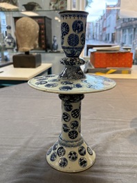 A pair of Chinese blue and white two-piece candle stick holders with brocade ball design for the Southeast Asian market, 19th C.