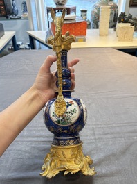 A pair of gilt-bronze-mounted Chinese famille verte powder-blue-ground double gourd vases, 19th C.