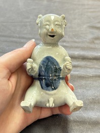 Nine Chinese blue, white, celadon-glazed and famille rose figures, 18/19th C.