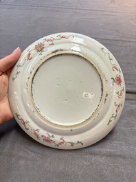 Three Chinese famille rose dishes, two plates and a saucer, various marks, 19th C.