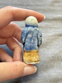 Nine Chinese blue, white, celadon-glazed and famille rose figures, 18/19th C.