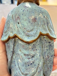 A Chinese robin's egg-glazed gilt-decorated standing Buddha, 18th C.