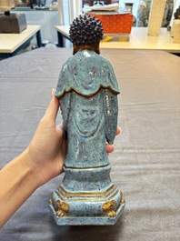 A Chinese robin's egg-glazed gilt-decorated standing Buddha, 18th C.