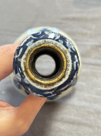 A pair of Chinese blue and white two-piece candle stick holders with brocade ball design for the Southeast Asian market, 19th C.