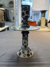 A pair of Chinese blue and white two-piece candle stick holders with brocade ball design for the Southeast Asian market, 19th C.