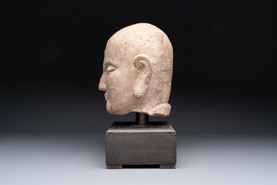 A Chinese sandstone head of a Luohan, early Qing