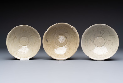A group of 12 Chinese celadon-glazed bowls with incised floral design from the Jepara shipwreck, Fujian kilns, Song
