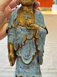 A Chinese robin's egg-glazed gilt-decorated standing Buddha, 18th C.