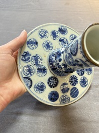 A pair of Chinese blue and white two-piece candle stick holders with brocade ball design for the Southeast Asian market, 19th C.