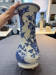 A Chinese blue and white vase with birds among flowering branches, Kangxi