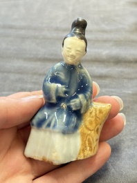 Nine Chinese blue, white, celadon-glazed and famille rose figures, 18/19th C.