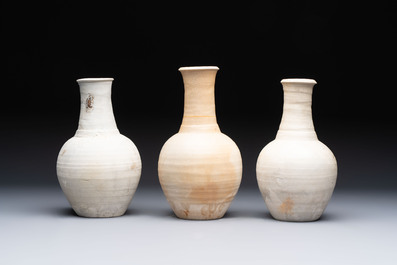 Three cream-glazed bottle vases and two jarlets from the Jepara shipwreck, Dehua or Anxi kilns, Song