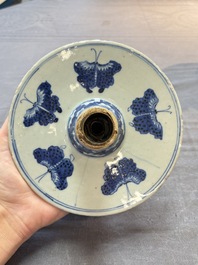 A pair of Chinese blue and white two-piece candle stick holders with brocade ball design for the Southeast Asian market, 19th C.